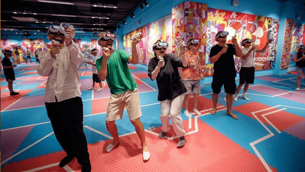 Guests playing together in a colorful free-roam VR arena